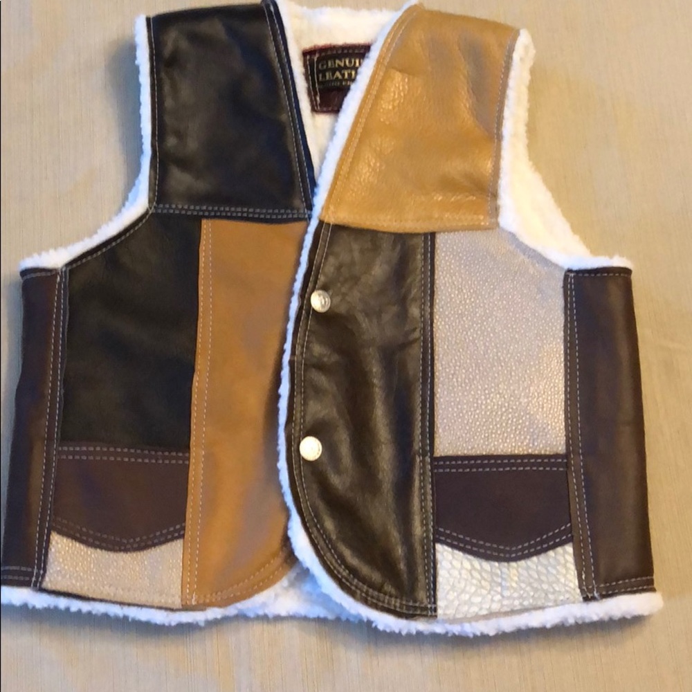 Kids leather vest with fleece lining.